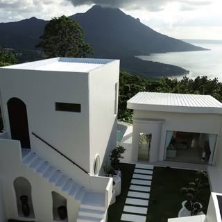 Salud by the Lake aerial view — white villa with infinity pool overlooking Taal Lake, Batangas