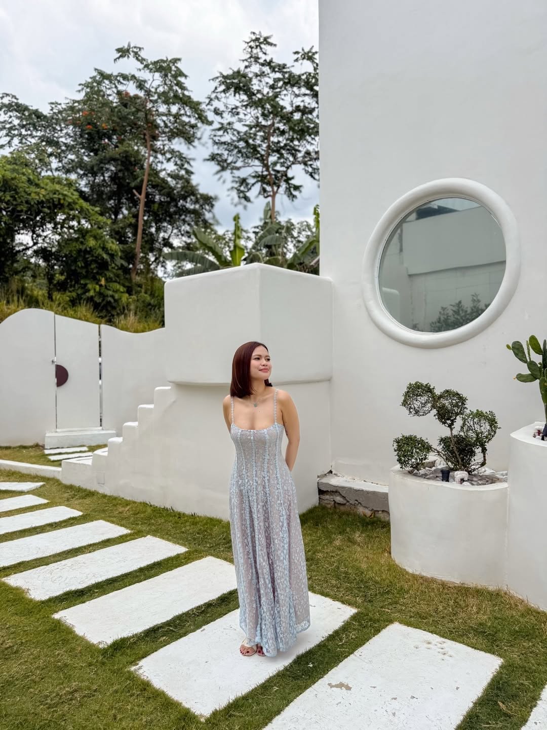 Salud by the Lake exterior — circular porthole and garden